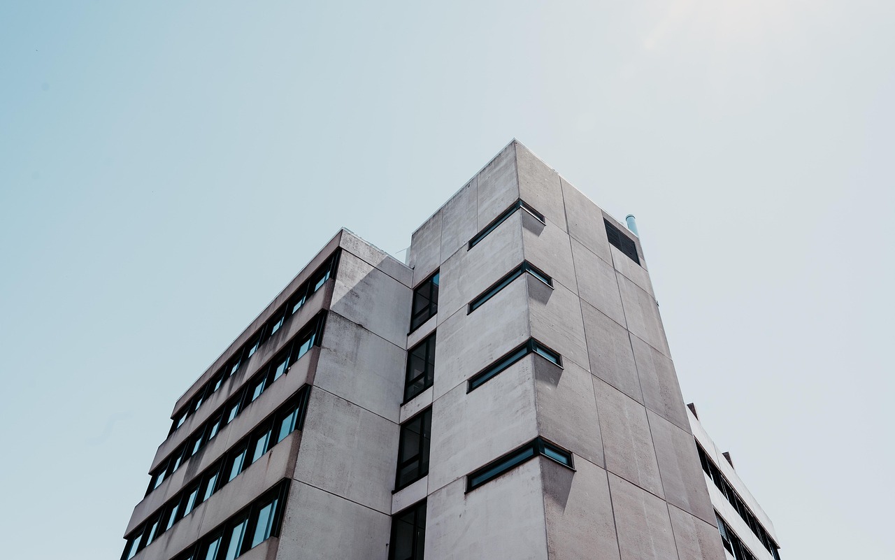 A brutalist civic building against the sky