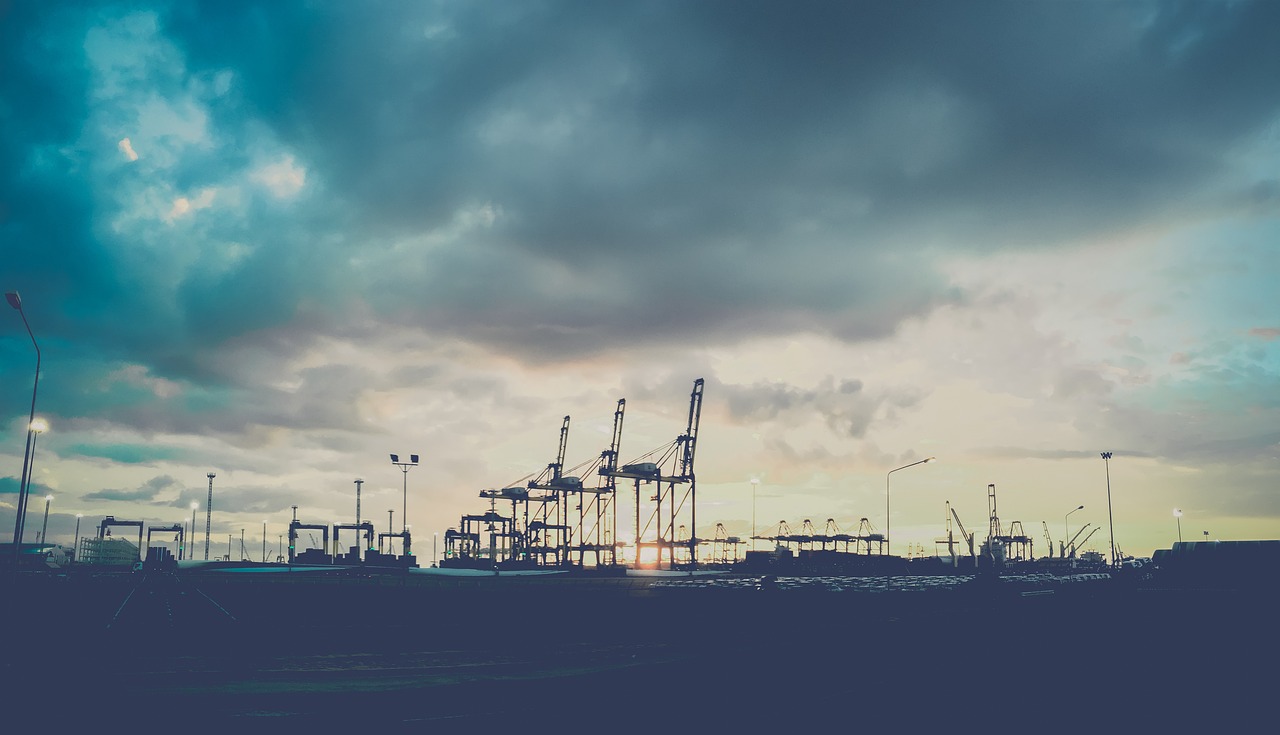 Harbour with cranes and infrastructure at dusk
