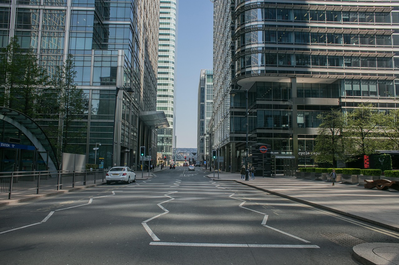 A financial-district street between glass towers