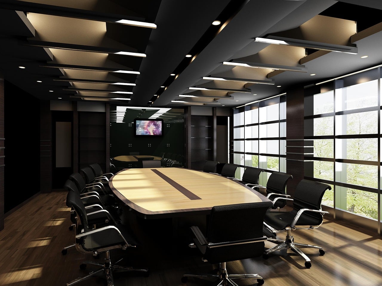 An empty boardroom with a long table and city view